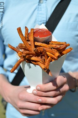 A cone of sweet potato fries. - PHOTO BY MATT DETURCK