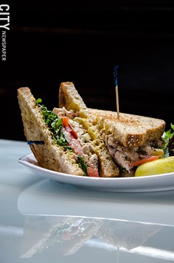 A Founders chicken salad sandwich with lettuce and tomato - PHOTO BY MARK CHAMBERLIN