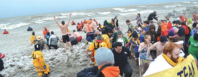 A shot from the 2012 Polar Plunge. The event, in which hundreds of Rochesterians willingly enter the icy waters of Lake Ontario, returns as part of the Lakeside Winter Celebration.