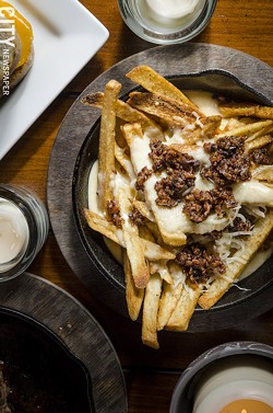 At Nox: "It's a Trap" is made of seasoned fries topped with melted cheese and sausage - PHOTO BY MARK CHAMBERLIN