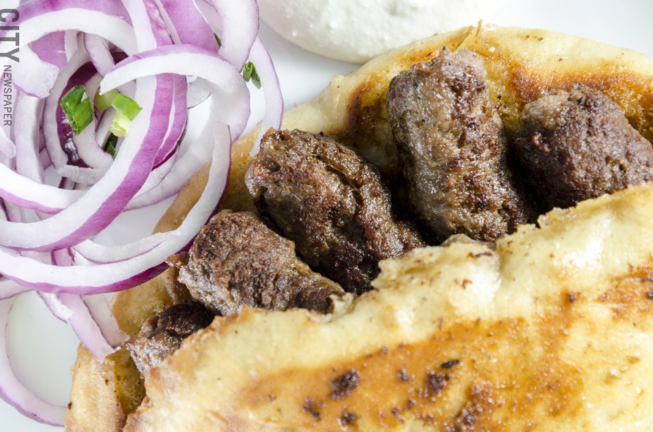 Cevapi made with spiced ground beef from Mamma Lucia. - PHOTO BY MARK CHAMBERLIN