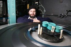 Chris Hogan-Roy is the lead projectionist at The Little. "There are still a lot of theaters running 35mm," he says. "That's a beautiful format that should never be ruined. Digital will be great for a lot of reasons, but I don't think digital will ever match film." - PHOTO BY MIKE HANLON