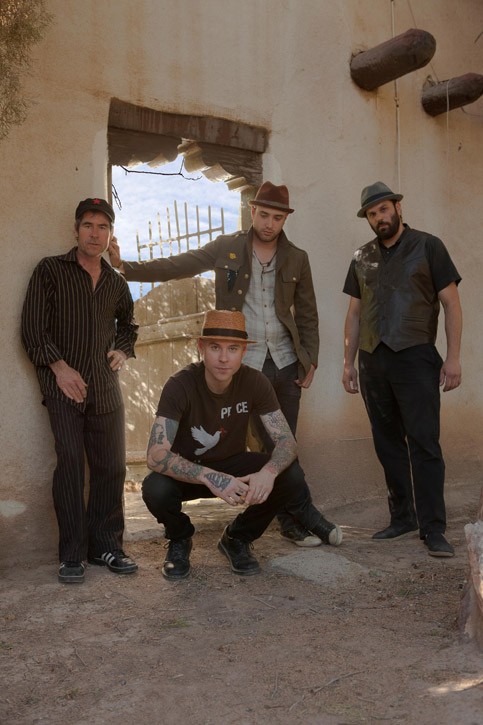 Flogging Molly bassist Nathen Maxwell (pictured crouching) started a side project, The Original Bunny Gang, to explore his personal musical interest and a totally different sound. - PHOTO COURTESY DONEZ