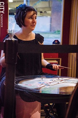 Katie Jo Suddaby with her sand mandala. - PHOTO BY MARK CHAMBERLIN