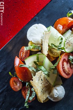 Organic Tomato Salad with cherry tomato, mozzarella espuma, broken balsamic vinaigrette, and baguette tuile - PHOTO BY MARK CHAMBERLIN