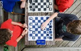 PHOTO BY MARK CHAMBERLIN - Six young men at Wilson Foundation Academy make up a competitive chess team. They've been playing together since kindergarten and have won state and national tournaments.