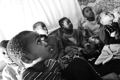 Somali children living on and around Vanauker Street congregate in Abdurahim Mukumbira's living room. - GARY VENTURA