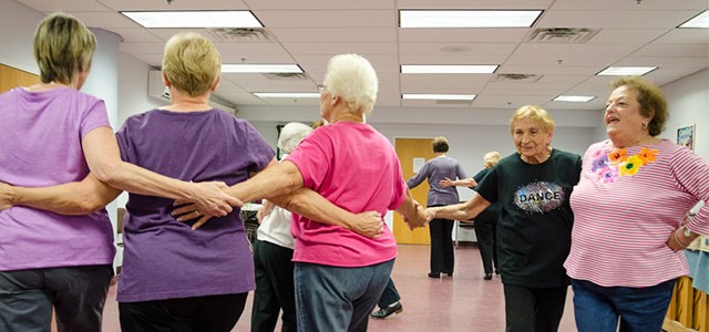 Students in an Oasis tap-dancing class rehearse for a performance.
