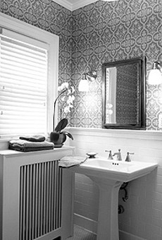 This water-damaged bathroom got new plaster, period-appropriate subway tile, and luxury in the form of a sauna.