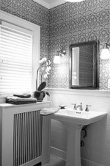 KURT BROWNELL - This water-damaged bathroom got new plaster, period-appropriate subway tile, and luxury in the form of a sauna.
