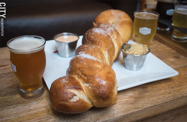Perfect to pair with any brew: the enormous soft pretzel at Sager Beer Works. - PHOTO BY JACOB WALSH