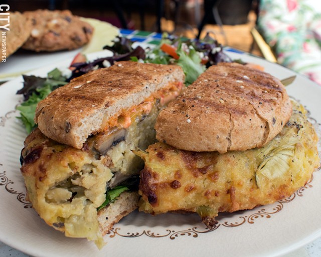 Mushroom artichoke burger and mixed field greens at Orange Glory Café. - PHOTO BY RENÉE HEININGER