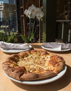 The white pizza is tasty simplicity. - PHOTO BY JACOB WALSH