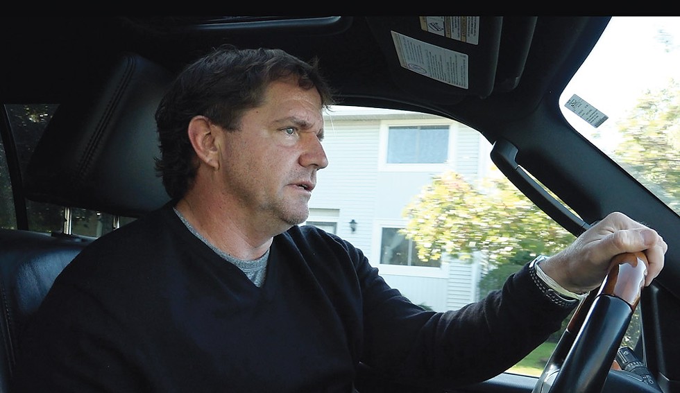 Rick Bates driving around his old neighborhood in his Lincoln Navigator. He says of his lawsuit that he wants vindication and to help other victims speak out. - PHOTO BY MAX SCHULTE