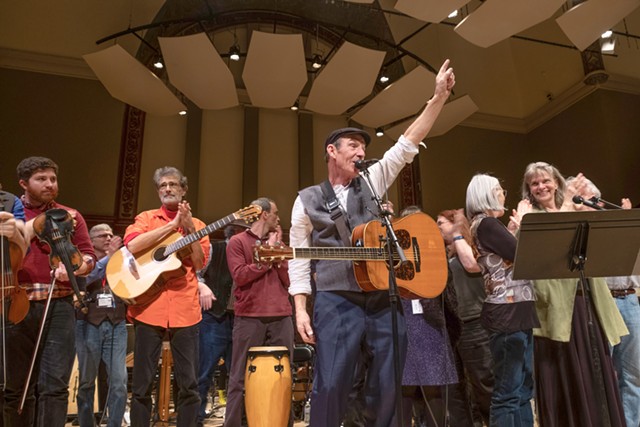 John Dady (foreground) leads the musicians at Hochstein Performance Hall in a concert tribute to his brother, the late Joe Dady. - PHOTO BY JULIE GELFAND