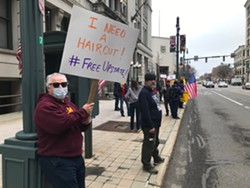 Tom Antinora, of Penfield, was among a few dozen demonstrators calling for businesses to reopen amid the coronavirus pandemic on Friday, May 1, 2020. - PHOTO BY DAVID ANDREATTA