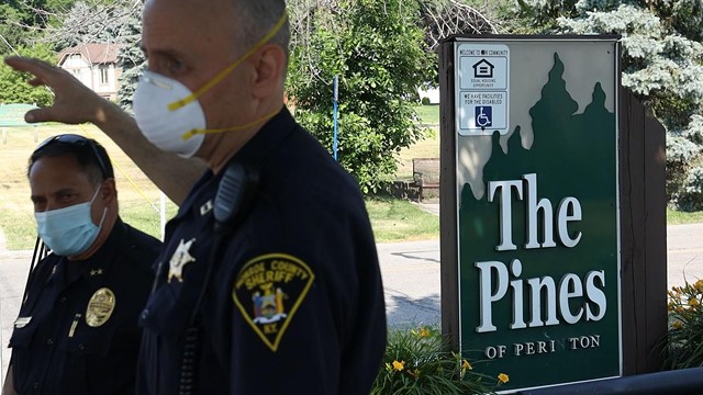 Fairport Police Chief Sam Farina (left), and Monroe County Sheriff's Deputy Capt. Andrew DeLyser address the media outside the Pines of Perinton in July 2020. - PHOTO BY MAX SCHULTE