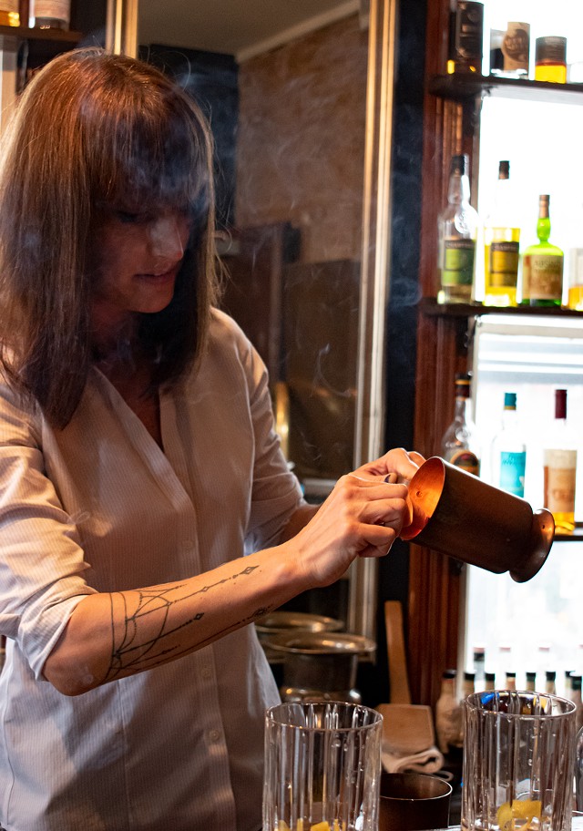Cheshire owner Evvy Fanning makes her version of the "Blue Blazer." - PHOTO BY JACOB WALSH