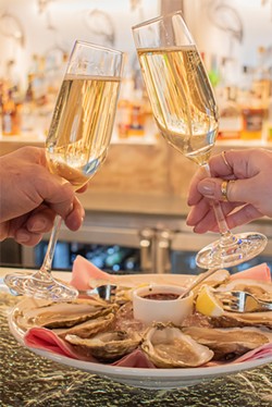 Champagne and oysters from the Erie Grill. - PHOTO BY JACOB WALSH