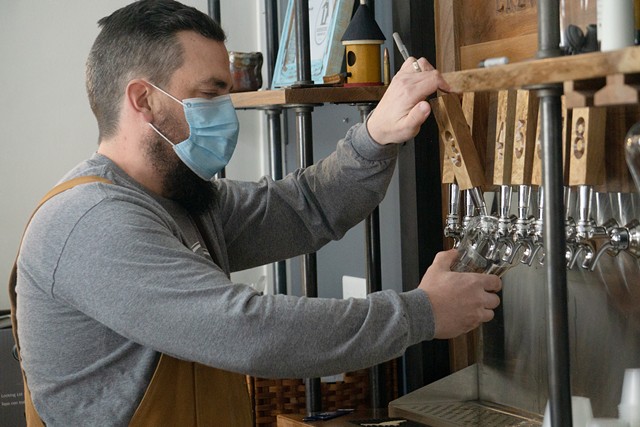 Greg Searles, co-owner of Birdhouse Brewing in Honeoye, pours a pint of ale. - PHOTO BY GINO FANELLI
