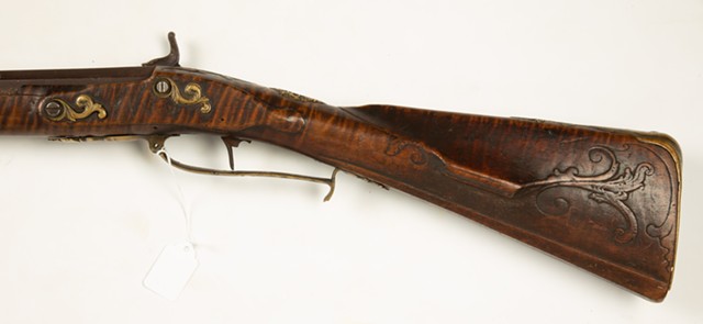 The engravings on the stock of the Rochester Historical Society's Kentucky rifle are consistent with the markings of Andreas Albrecht, an 18th-century gunsmith considered a patriarch of Kentucky rifles. - COTTONE AUCTIONS