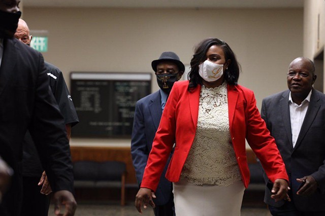 Rochester Mayor Lovely Warren arrives Wednesday morning at the Hall of Justice for arraignment on charges that include criminal possession of a firearm and endangering the welfare of a child. - PHOTO BY MAX SCHULTE