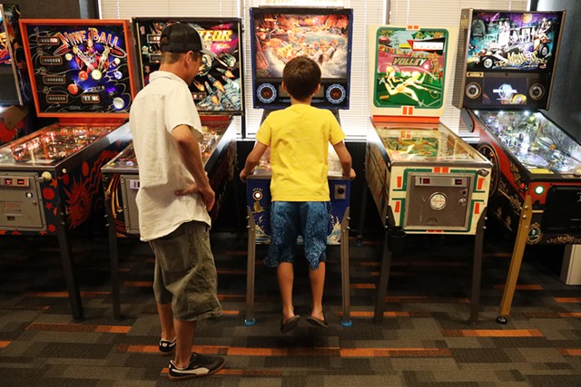 Everyday adults for whom pinball is nothing more than a diversion find nostalgia at Rochester Pinball Collective, while younger visitors who have never known gaming to mean interacting with other humans in public find a revelation. - PHOTO BY MAX SCHULTE