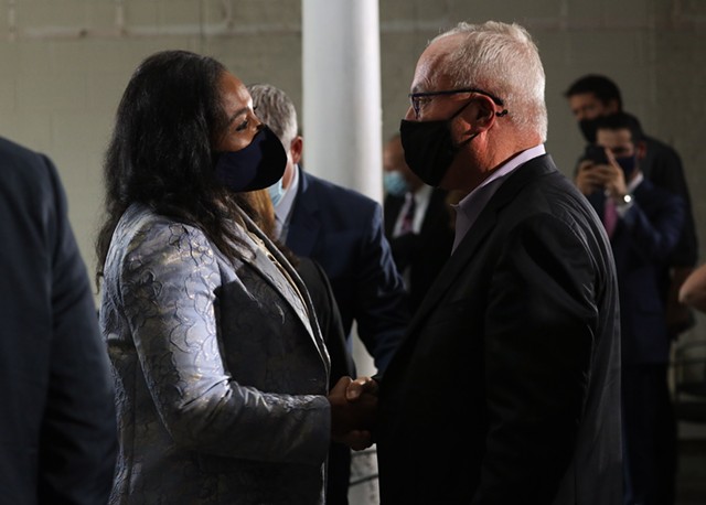 Mayor Lovely Warren chats with Constellation CEO Bill Newlands after Wednesday's announcement that the company plans to move its headquarters from Victor to downtown Rochester. - PHOTO BY MAX SCHULTE