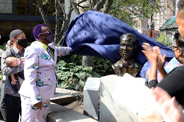 Thomas Warfield, the nephew of William Warfield, unveils the bust of his uncle created by artist Shawn Dunwoody. - PHOTO BY MAX SCHULTE