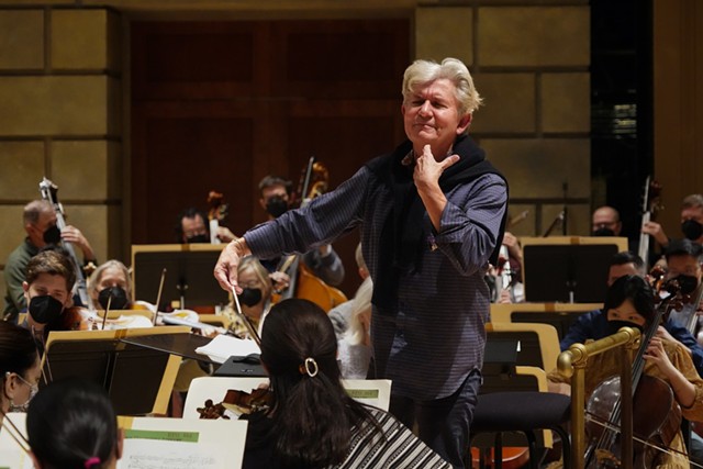 RPO Music Director Andreas Delfs conducts the orchestra during a rehearsal for "Hansel and Gretel." - PHOTO BY TYLER CERVINI