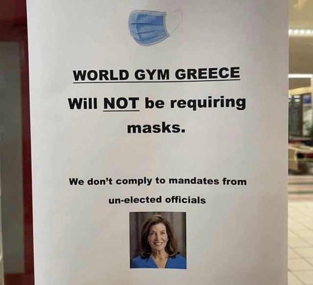 A sign on the door of World Gym in Greece informed customers that it would not comply with the state mask mandate.
