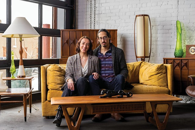 Eliza Page and John Fioravanti, owners of MidCentury585, with some of the furniture they sell in their space inside the Refinery building in the Plymouth-Exchange neighborhood. - PHOTO BY LAUREN PETRACCA