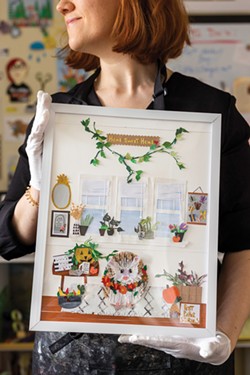 Laura Homsey, owner of Petit Paper Stories, holds a piece she made for a client who commissioned her when their pet hedgehog died. - PHOTO BY LAUREN PETRACCA