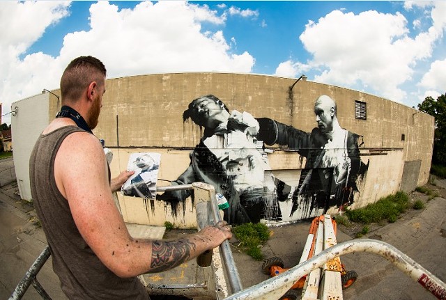 Irish artist Conor Harrington checks his sketch against his in-progress mural on the El Camino Trail in 2013. Harrington is among the Wall\Therapy alumni who will return to Rochester this month for Wall\Therapy's 10th anniversary festival. - PHOTO PROVIDED