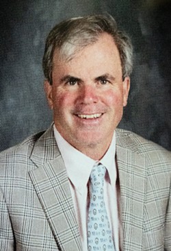 Teacher John Baynes in a recent Our Lady of Mercy yearbook. Baynes said the school's handling of a rescinded letter of recommendation for Lola DeAscentiis was a factor in his deciding to retire.