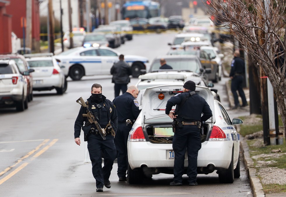 Rochester police officers on the scene of where an officer was shot in December 2020. - PHOTO BY MAX SCHULTE