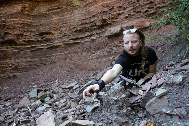 Amateur rock hound Khoury Humphrey hunts the Genesee River gorge for fossils of early animals and plants, which he sometimes carves into small sculptures of teeth. - PHOTO BY MAX SCHULTE
