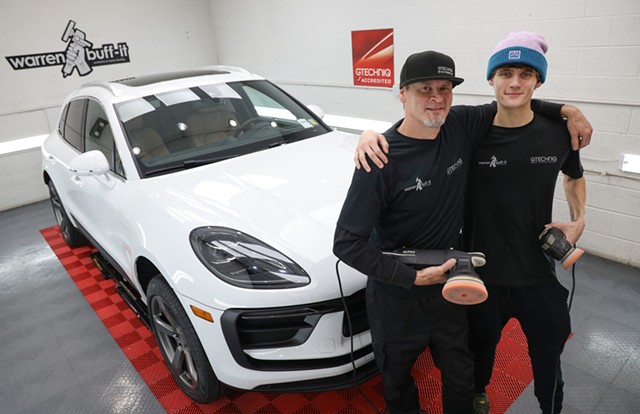 Warren Mapes, owner of Warren Buff-It, and his son Connor Mapes take a pause from detailing a 2023 Porsche Macan. - PHOTO BY MAX SCHULTE