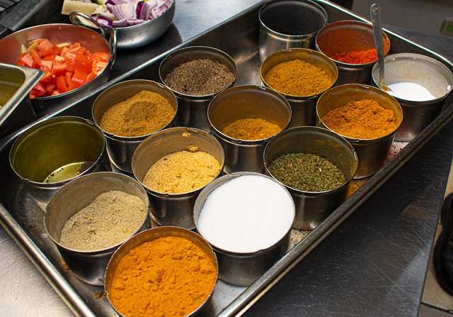 The never-empty spice rack in the kitchen at Thali of India. - PHOTO BY JACOB WALSH
