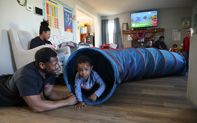Richard Morris plays with 2-year-old Legend Sirman at Morris Munchkins Playhouse in Chili. - PHOTO BY MAX SCHULTE
