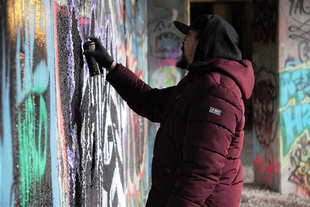 Victor "Range" Zarate has been painting the walls of the aqueduct with his graffiti partners, FUA Krew, for more than 30 years. He believes their work made the aqueduct culturally relevant and hopes to see the art preserved. - PHOTO BY GINO FANELLI