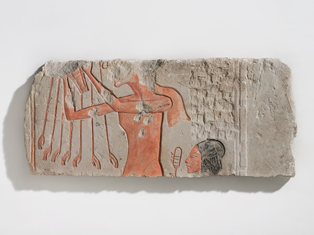 An object labeled "Akhenaten and His Daughter Offering to the Aten" is an example of iconoclasm in ancient Egypt, and is part of an exhibit organized by the Brooklyn Museum on view at the Memorial Art Gallery. Akhenaten made drastic changes to how religion was allowed to be practiced during his lifetime, decisions that were reversed after his death. Vandals used a chisel on this image to destroy the pharaoh's identity and ability to make offerings to the god. - PHOTO COURTESY BROOKLYN MUSEUM