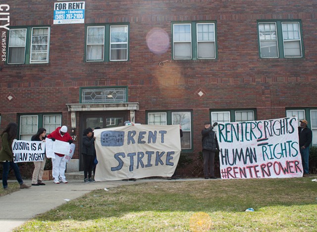 Tenants at 967 Chili Ave. rally outside of their building in 2018 to protest poor conditions. Peter Hungerford and other investors owned the building. - PHOTO BY JAKE CLAPP