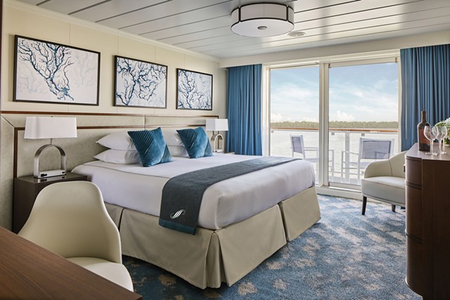 A stateroom with a balcony aboard a Pearl Seas Cruises ship. - PHOTO PROVIDED