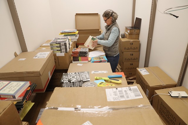 Jenny Smith inventories a recent shipment of books. - PHOTO BY MAX SCHULTE
