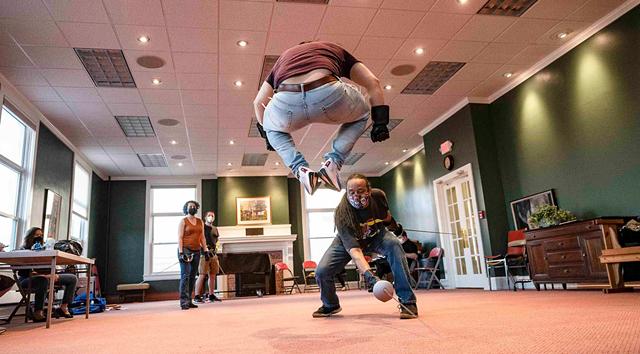 Joey Chacon dodges Jahaka Mindstorm as they rehearse a fight scene in "Les Misérables." - PHOTO BY NICOLAS SAMPER