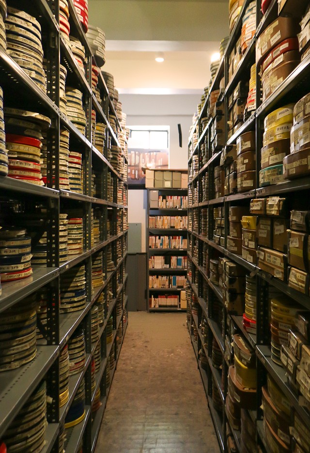 Racks of film reels stretch to the ceiling in VSW’s collections room. - JACOB WALSH.