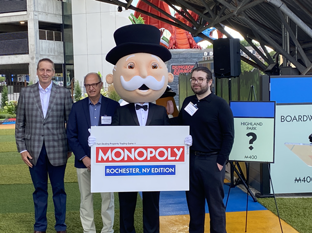 Greater Rochester Chamber of Commerce CEO Bob Duffy, Strong Museum of Play head Steve Dubnik and Hasbro representative John Marano pose with Mr. Monopoly to announce the upcoming Rochester version of the board game. - PATRICK HOSKEN