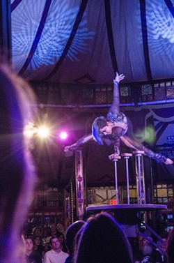 A contortionist performs in "Cabinet of Wonders" inside of the Spiegeltent during the 2015 Rochester Fringe Festival. - PHOTO BY MARK CHAMBERLIN