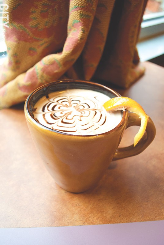 Dark Horse Coffee adds an orange slice and cranberry flavoring for a tangy latte. - PHOTO BY RYAN WILLIAMSON